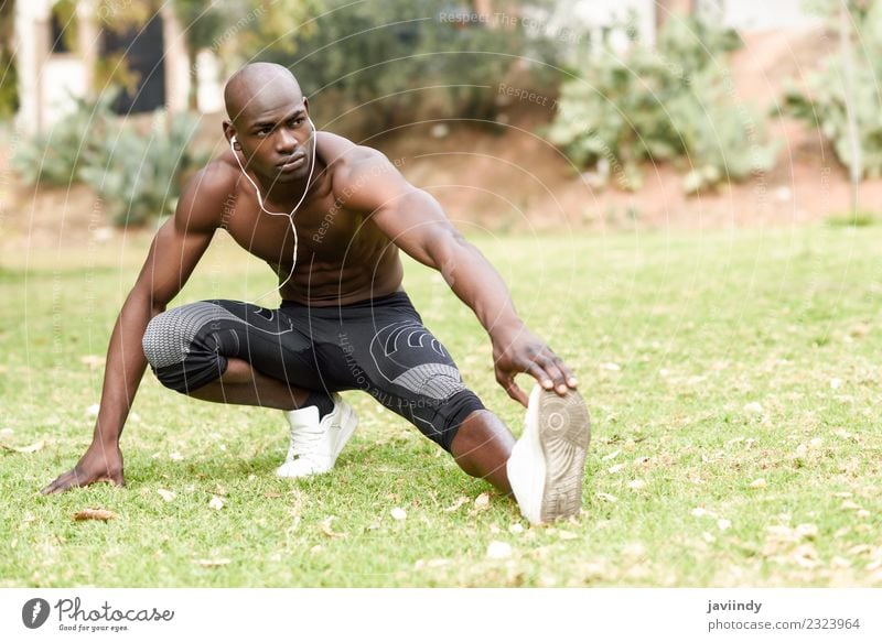 Fit shirtless young black man doing legs stretching Lifestyle Body Sports Human being Masculine Young man Youth (Young adults) Man Adults 1 18 - 30 years