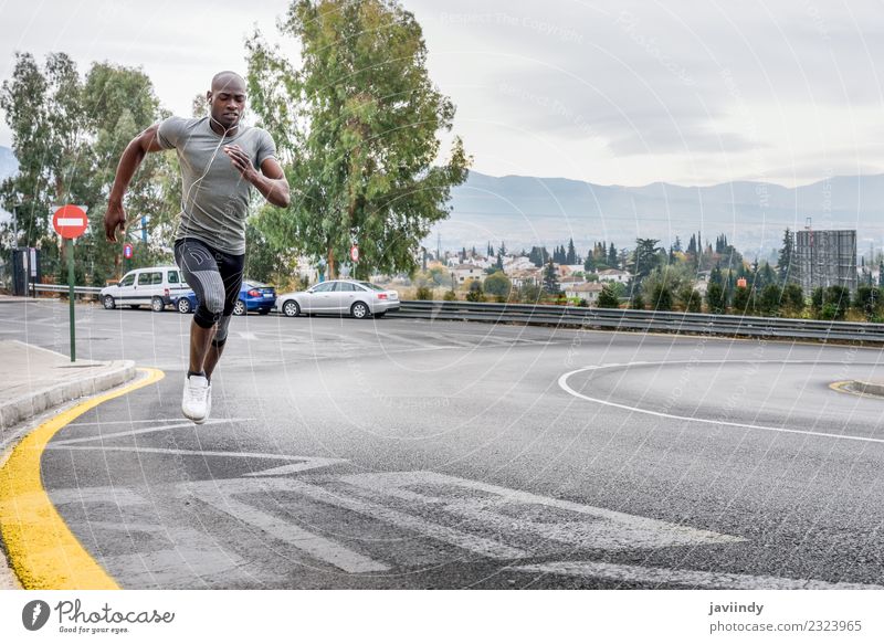 Black man running outdoors in urban road Lifestyle Body Sports Jogging Human being Masculine Young man Youth (Young adults) Man Adults 1 18 - 30 years Fitness