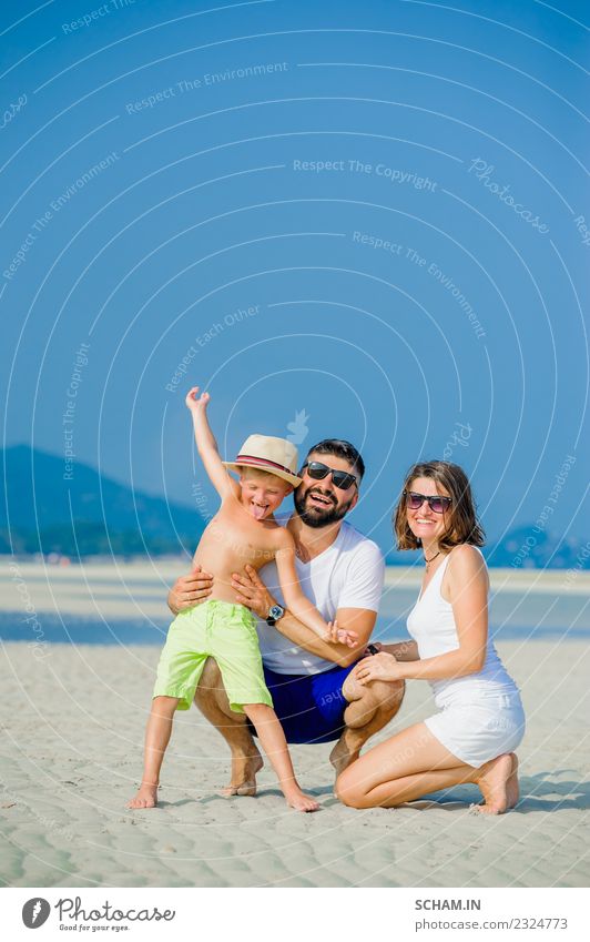 Happy young family of three having fun on the desert sunny beach Lifestyle Joy Playing Summer Ocean Island Human being Masculine Feminine Child Boy (child)