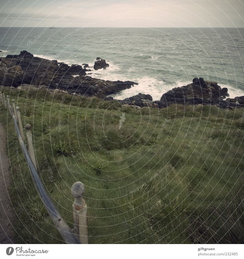 stormy sea Environment Nature Landscape Elements Water Sky Horizon Weather Bad weather Wind Grass Meadow Rock Waves Coast Ocean Island Gale Fence Boundary