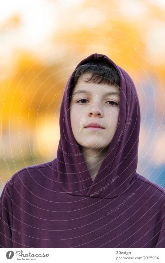 Portrait of a teen wearing a hodded while looking camera Lifestyle Beautiful Face Child Human being Boy (child) Man Adults Infancy Nature Autumn Park Fashion