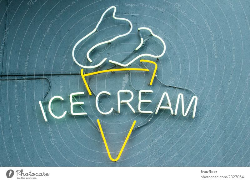 ice cream Ice cream Shopping Vacation & Travel Wall (barrier) Wall (building) Sign Characters Signs and labeling Yellow Gray White Neon sign Neon light