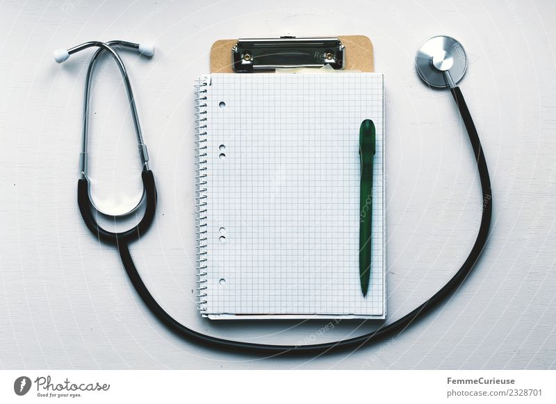 Notebook, clipboard and stethoscope on table Work and employment Profession Doctor Competent clamping board Ballpoint pen collegiate block Checkered Stethoscope