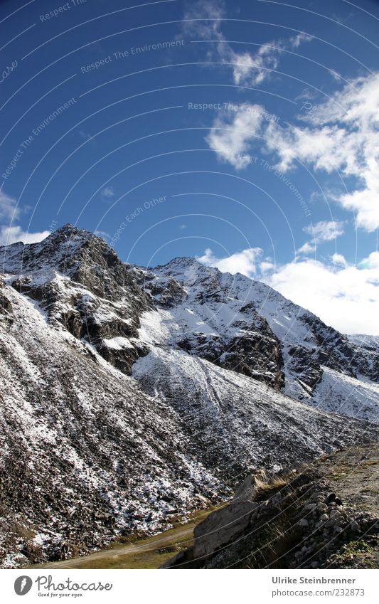 At the Timmelsjoch in the Ötztal Alps Freedom Mountain Nature Landscape Sky Clouds Autumn Beautiful weather Snow Rock Peak Snowcapped peak Canyon Glittering