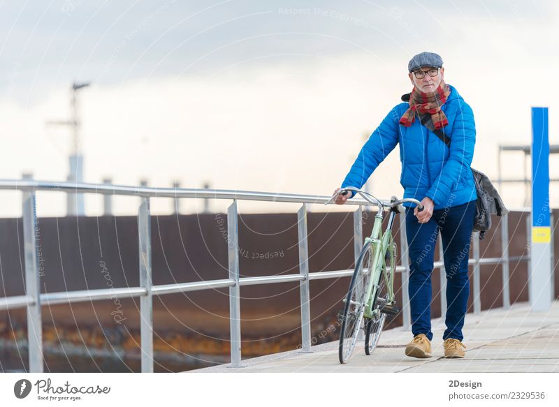 Portrait senior man walking with his bicycle next to the sea Lifestyle Elegant Leisure and hobbies Vacation & Travel Freedom Ocean Bicycle Human being Masculine