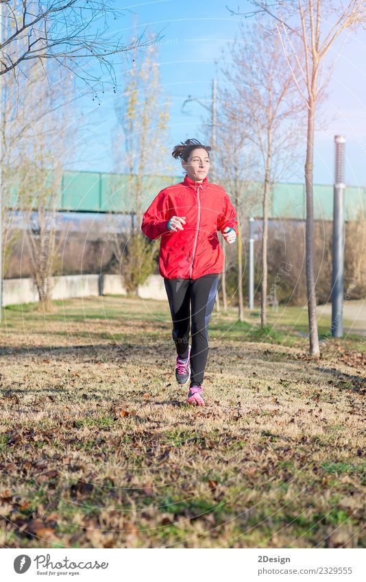 Runner woman jogging at the park Lifestyle Joy Happy Beautiful Athletic Fitness Relaxation Leisure and hobbies Winter Sports Track and Field Sportsperson