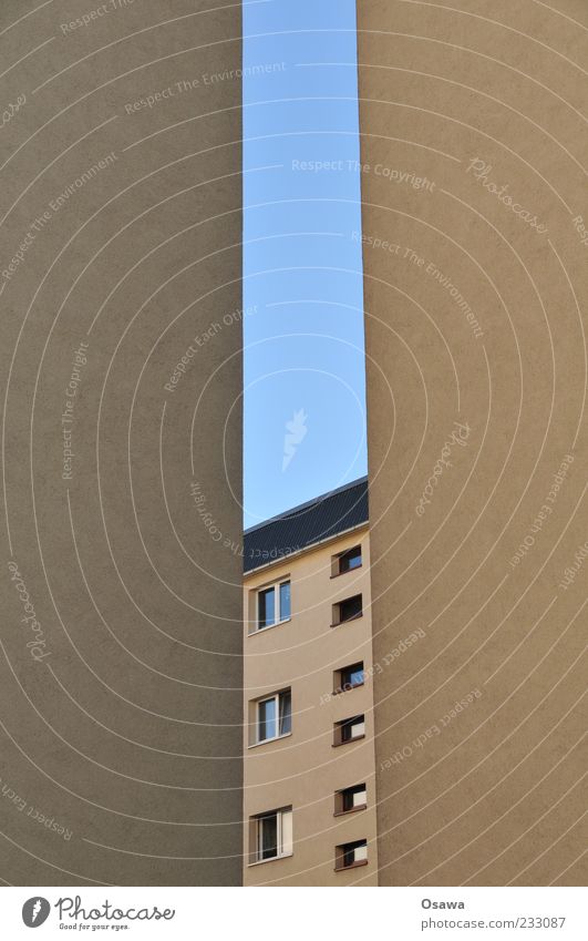 Room with a view Building Apartment Building Window Wall (building) Fire wall Facade Plaster Gray Blue Sky Slit Portrait format Copy Space right Copy Space left