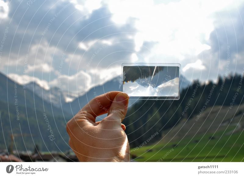 twisted world Hand Nature Landscape Clouds Beautiful weather Forest Alps Mountain Peak Magnifying glass Discover Looking New Crazy Enthusiasm Surprise