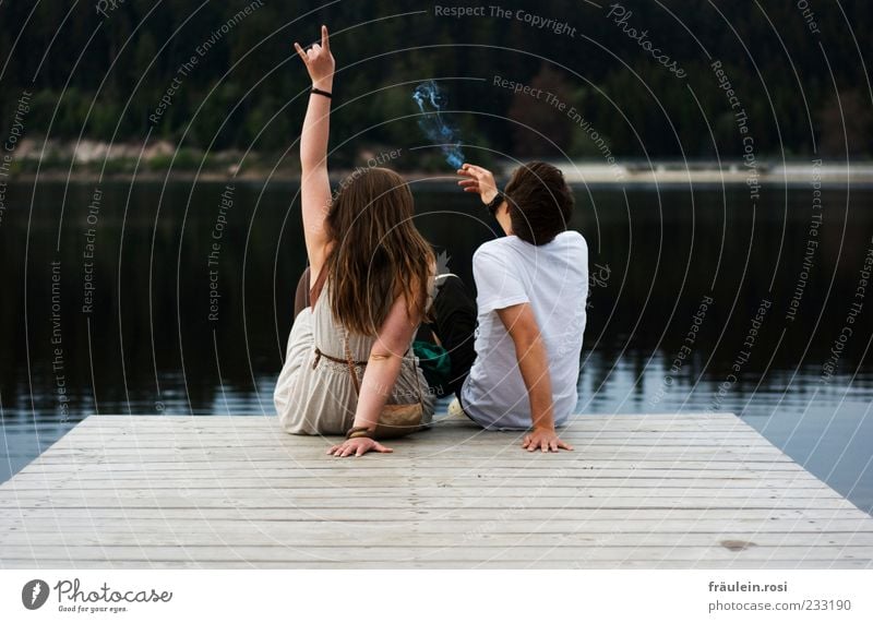 Rock at the (dam)lake Smoking Young woman Youth (Young adults) Young man Back Arm Hand 2 Human being 18 - 30 years Adults Water Lake Reservoir Sit Together Joy