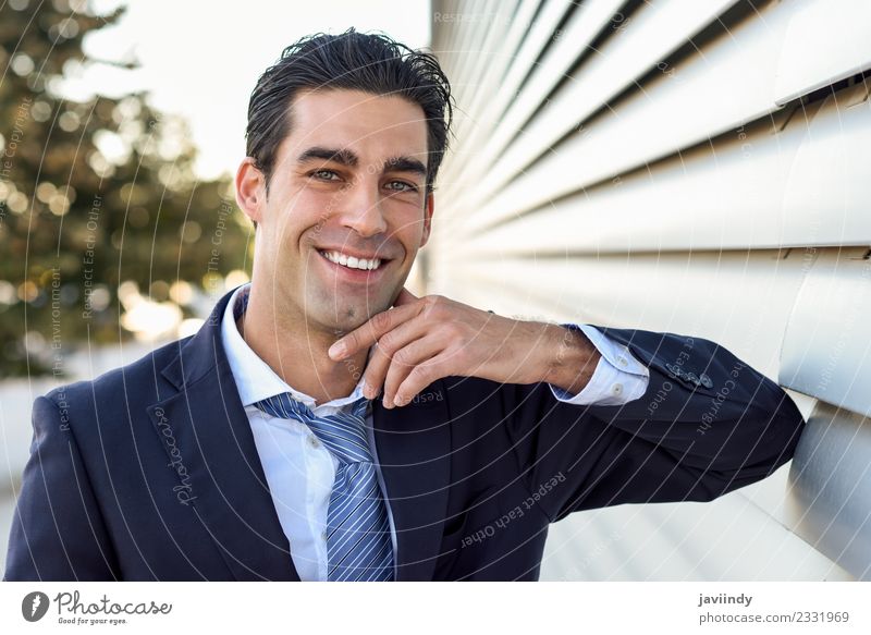 Businessman in blue suit and tie in urban background Success Work and employment Human being Masculine Young man Youth (Young adults) Man Adults 1 30 - 45 years