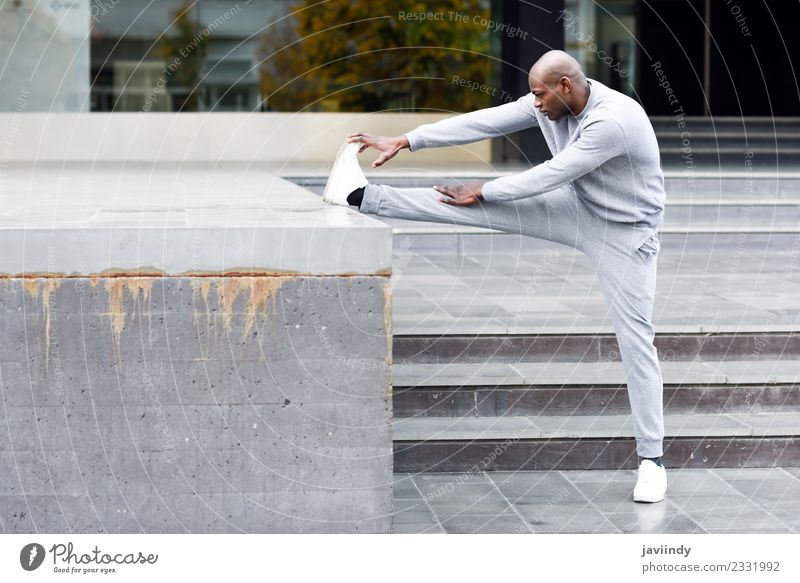 Black man doing stretching after running outdoors Lifestyle Body Sports Jogging Human being Masculine Young man Youth (Young adults) Man Adults 1 18 - 30 years