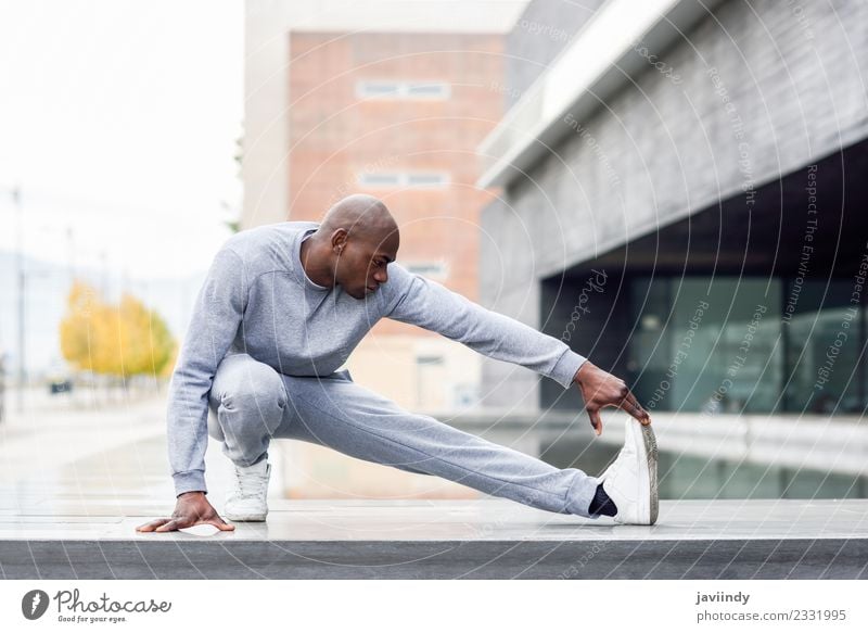 Black man doing stretching after running outdoors Lifestyle Body Sports Jogging Human being Masculine Young man Youth (Young adults) Man Adults 1 18 - 30 years