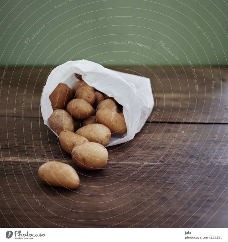 potatoes Food Vegetable Potatoes Nutrition Organic produce Vegetarian diet Good Wooden table Colour photo Interior shot Deserted Copy Space top Lie Paper bag