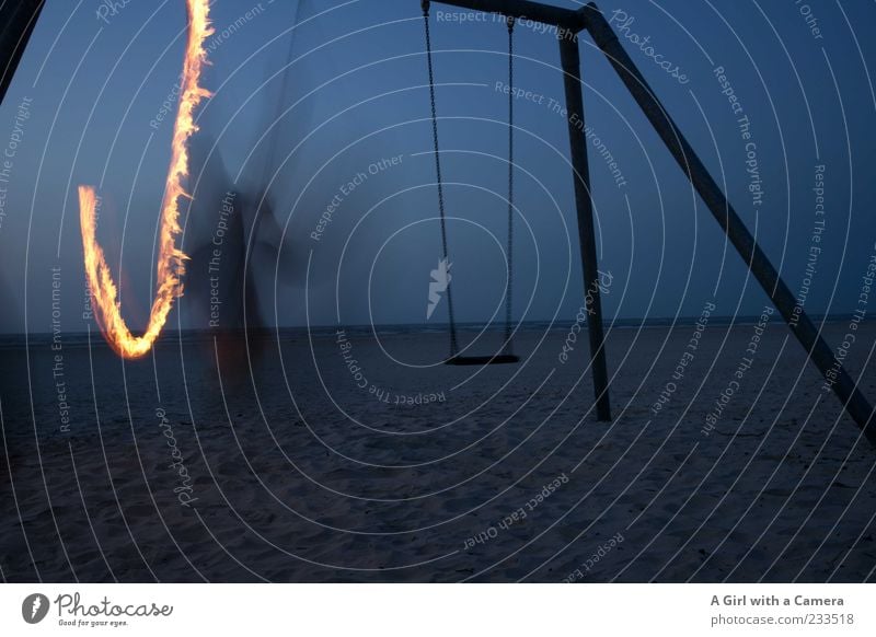 Spiekeroog I One of the Swinging Paddys Beach Ocean Man Adults 1 Human being Movement To swing Blue Fire Flame Torch Long exposure Structures and shapes