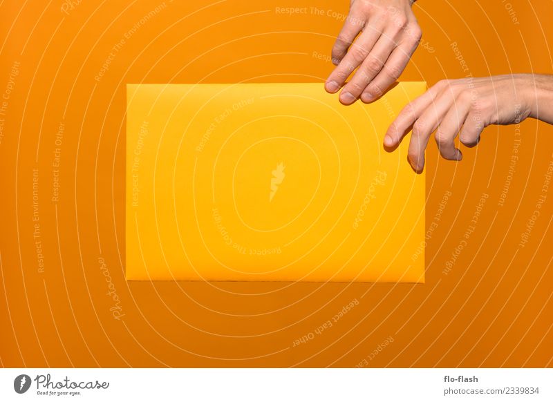 TWO HANDS GRABBING YELLOW PAPER Lifestyle Design Beautiful Healthy Wellness Playing Handcrafts Trade Media industry Advertising Industry Craft (trade) Business