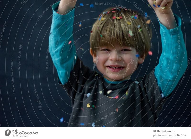 Child playing with confetti Boy (child) Happy Joy Human being Face Playing 1 - 3 years Toddler 3 - 8 years Infancy Blonde Laughter Authentic Exceptional Brash