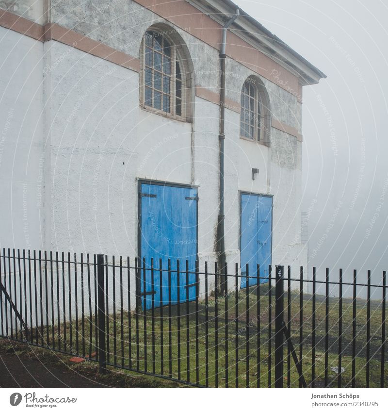 House in the fog in Glasgow Town House (Residential Structure) Esthetic Fog Shroud of fog Haze Scotland Fence Door Blue Facade Creepy Misty atmosphere