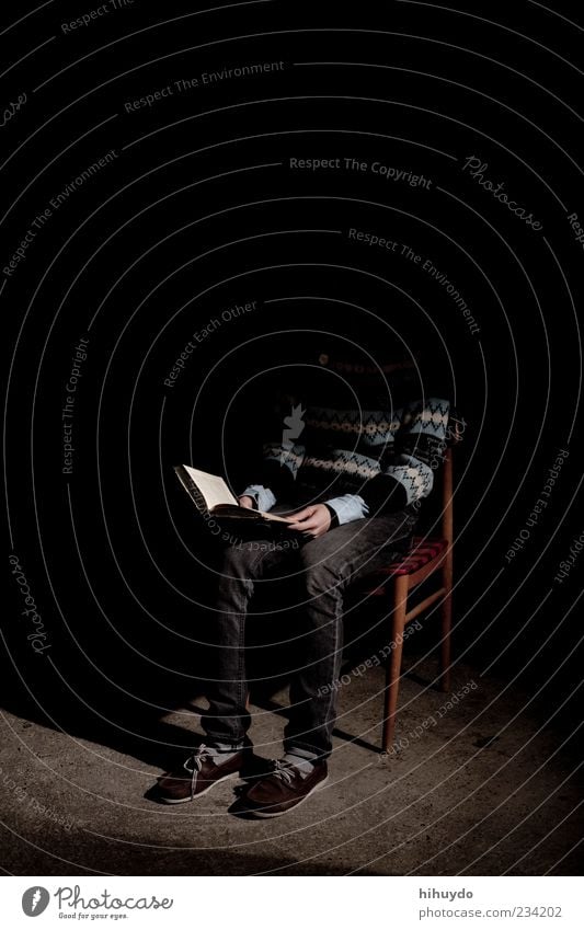 reading in the dark Leisure and hobbies Reading Chair Education Human being Masculine 1 Print media Book To enjoy Study Dark Elegant Creepy Reliability Moody