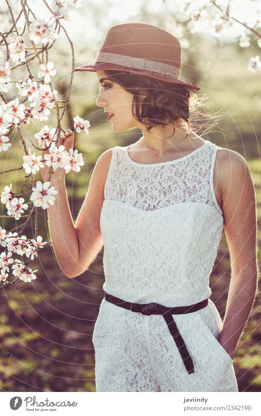 Young woman smelling almonds flowers in spring time Style Happy Beautiful Hair and hairstyles Face Human being Feminine Youth (Young adults) Woman Adults 1