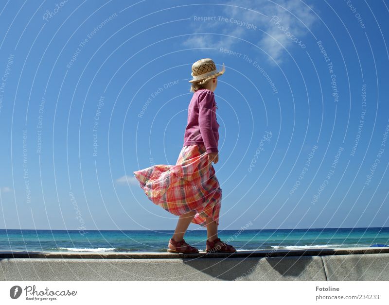 summer Human being Feminine Girl Infancy Arm Legs Feet Environment Nature Beautiful weather Waves Coast Ocean Bright Wind Hat Dress Jacket Sandal Going Balance