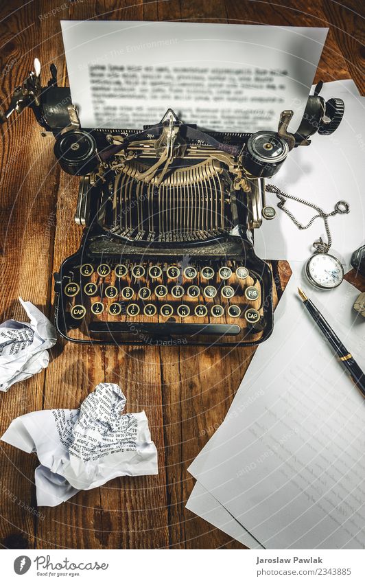 Text prescribed on a vintage typewriter and watch timekeeper. Design Office Business Technology Book Paper Metal Steel Rust Old Write Retro Black White