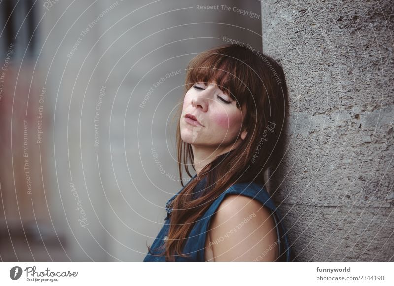 Woman with closed eyes leans on stone pillar Human being Feminine Adults 1 30 - 45 years Hair and hairstyles Brunette Red-haired Long-haired Bangs Sleep