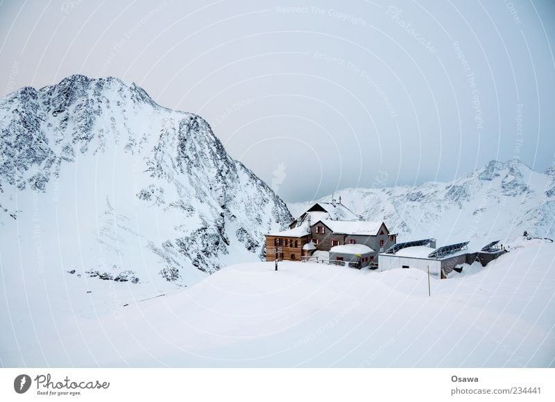 House in the mountains Mountain Rock Peak Snowcapped peak Mountain ridge Alps Winter White Cold Sky Twilight House (Residential Structure) Hut Monochrome Sparse