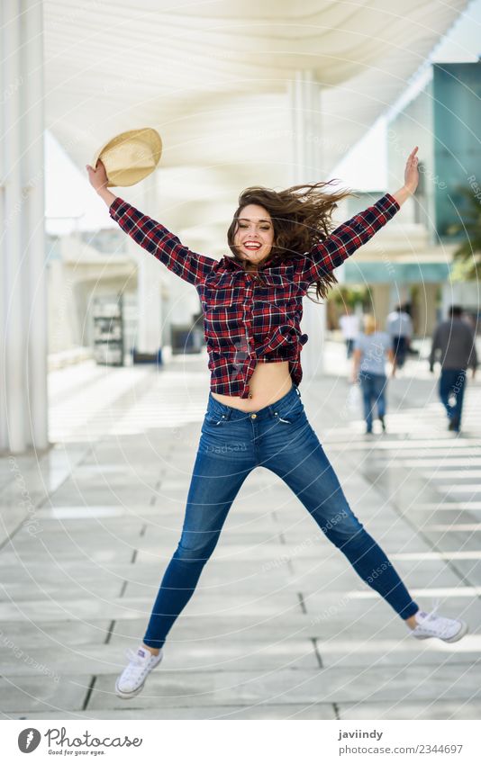 Girl jumping in urban background. Style Happy Beautiful Summer Human being Young woman Youth (Young adults) Woman Adults 1 18 - 30 years Fashion Shirt Hat