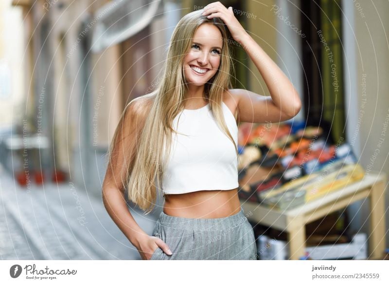 Smiling young woman in urban background. Lifestyle Elegant Style Happy Beautiful Hair and hairstyles Summer Human being Feminine Young woman