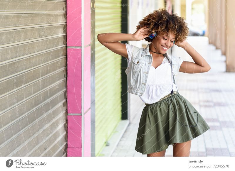 Black woman listening to the music with headphones Lifestyle Joy Hair and hairstyles Music Human being Feminine Young woman Youth (Young adults) Woman Adults 1