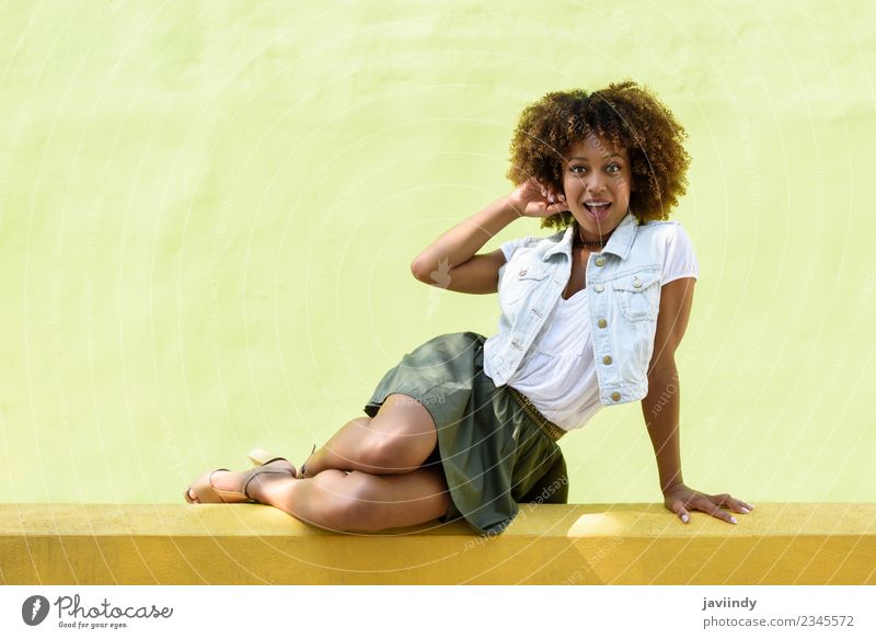 Young black woman, afro hairstyle, sitting outdoors Lifestyle Style Happy Beautiful Hair and hairstyles Face Human being Feminine Young woman