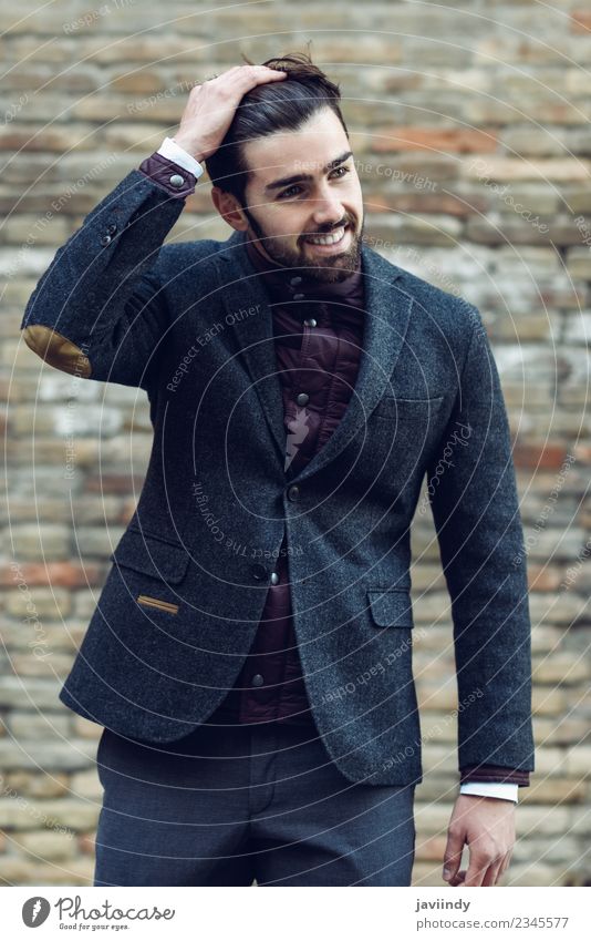 Young man smiling in urban background wearing elegant suit Lifestyle Elegant Style Happy Beautiful Hair and hairstyles Human being Masculine