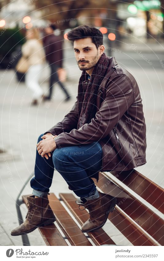 Thoughtful young man sitting on an urban bench Lifestyle Style Beautiful Hair and hairstyles Human being Masculine Young man Youth (Young adults) Man Adults 1