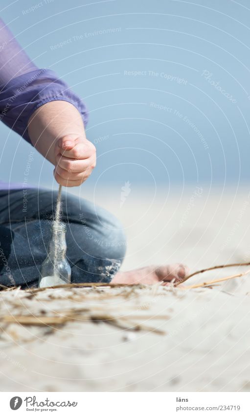 Spiekeroog sand cake was served yesterday. Human being Woman Adults Hand 1 Coast Beach North Sea Glass Sit Playing Joy Joie de vivre (Vitality) Contentment