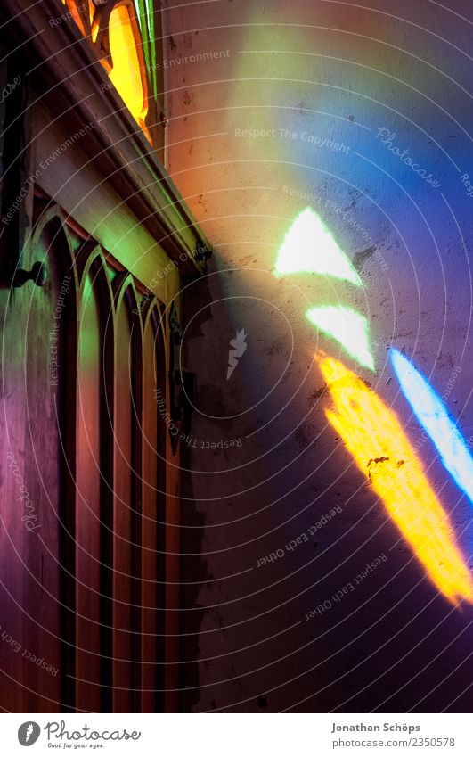 colorful light falls through a church feast Art Esthetic Moody Church Religion and faith Stained glass Church window Church door Illuminate Belief Ray of hope