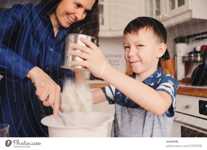 mother and son cooking Food Human being Child Boy (child) Young woman Youth (Young adults) Woman Adults Parents Mother Family & Relations Joy Happiness Cooking