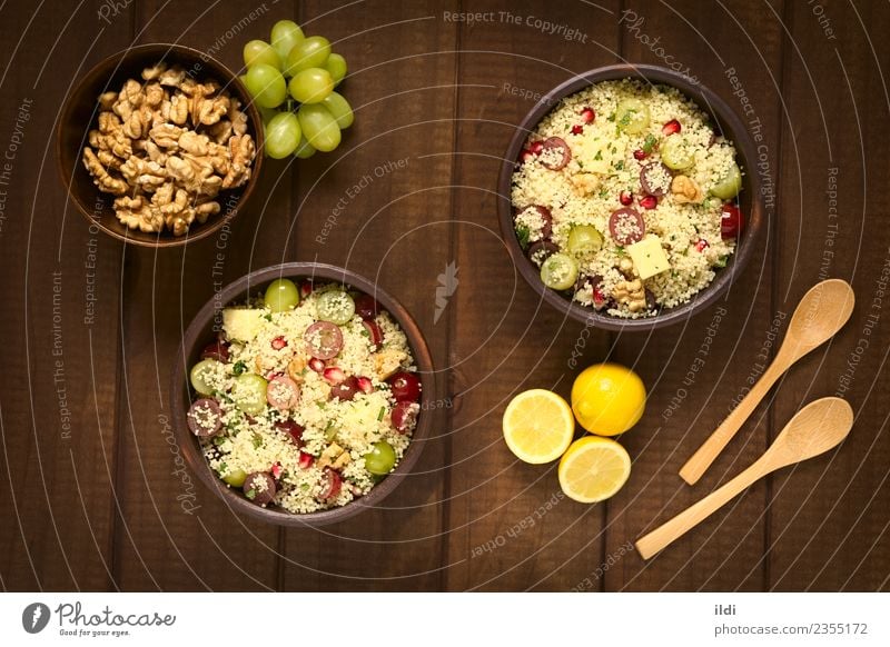 Couscous with Grapes, Pomegranate, Nuts and Cheese Fruit Grain Lunch Dinner Vegetarian diet Fresh couscous Salad nut walnut Dairy Mint food Meal Dish healthy