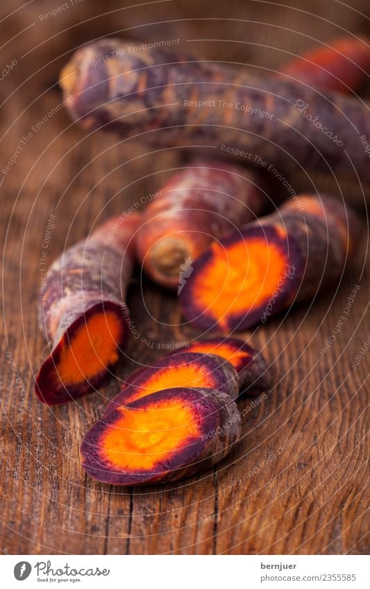 cut carrots on dark wood Food Vegetable Nutrition Organic produce Vegetarian diet Diet Nature Plant Wood Dark Fresh Small Brown Violet Carrot Root vegetable