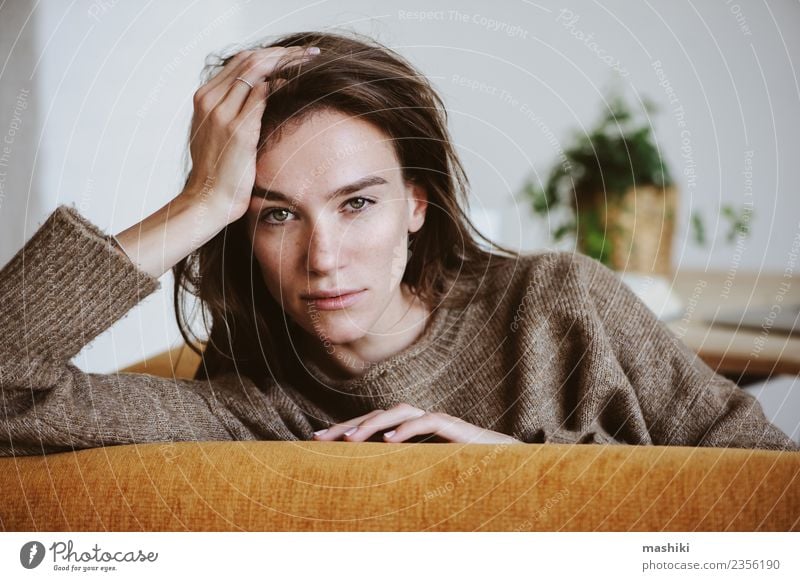 indoor portrait of beautiful woman Lifestyle Face Chair Feminine Woman Adults Sweater Sadness Wait Natural Emotions Fatigue Loneliness Stress Considerate young