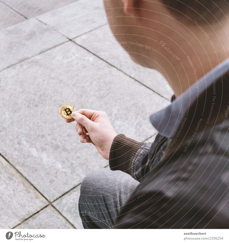 young man holds Bitcoin coin in his hand Human being Masculine Young man Youth (Young adults) Man Adults 1 18 - 30 years Money Financial Industry Cryptocurrency