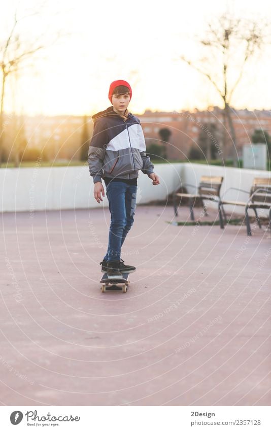 Kid skateboarder doing a skateboard trick. Lifestyle Style Happy Leisure and hobbies Summer Sports Human being Masculine Boy (child) Man Adults