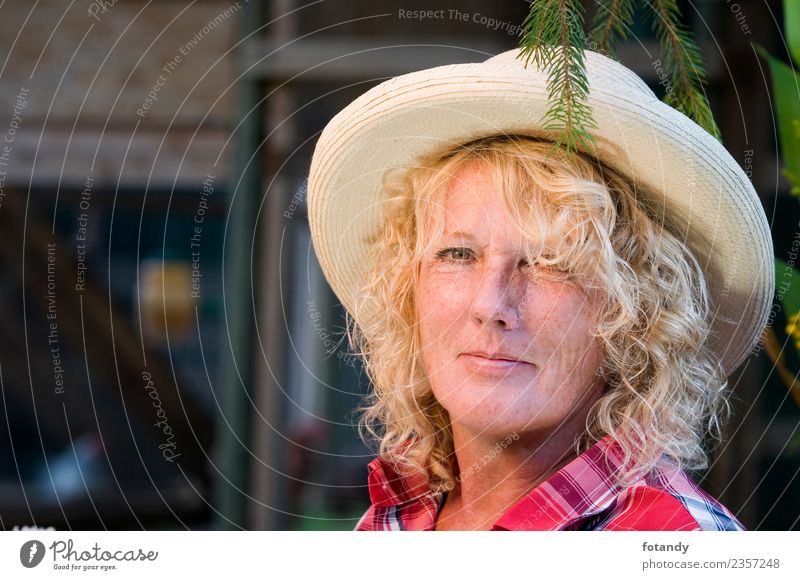 head portrait of blond woman with hat Style Garden Human being Feminine Woman Adults Head 1 45 - 60 years T-shirt Shirt Cloth Hat Blonde Long-haired Curl