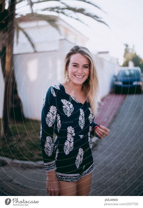 Young stylish woman smiling while taking walk in summer Sun Beach Blonde Cool (slang) Dusk Joy Young woman Good Laughter Lifestyle Ocean Retro Sand Smiling