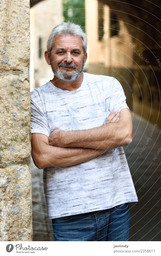 Mature man smiling at camera in urban background. Lifestyle Happy Human being Man Adults Male senior Senior citizen 1 45 - 60 years 60 years and older Street