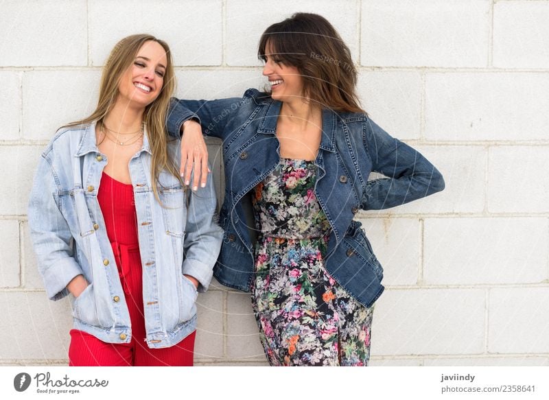 Two young women smiling in urban background. Lifestyle Style Joy Happy Beautiful Human being Young woman Youth (Young adults) Woman Adults Friendship 2