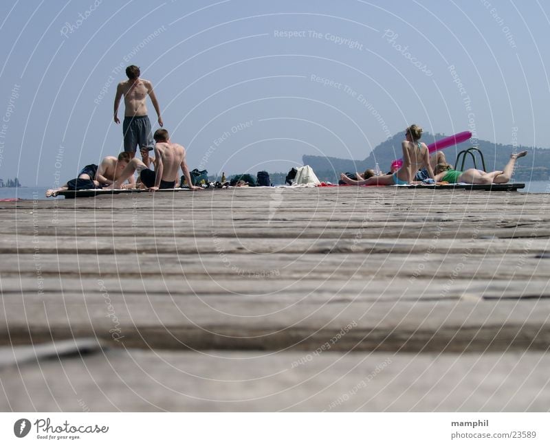 On the footbridge Footbridge Wooden board Man Woman Bikini Italy Lake Ocean San Felice del Benaco Lake Garda Europe Human being Youth (Young adults) swimwear