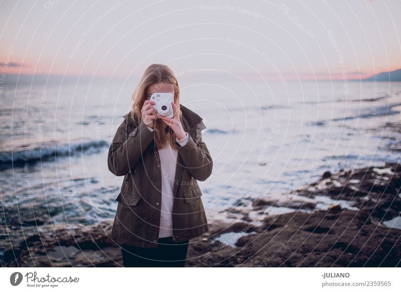 woman taking picture with retro camera of breathtaking sunset Beach Dusk Emotions Girl Happy Life Lifestyle Spain Summer Sun Sunset Warmth Communicate Memory