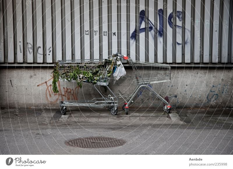 We have to go shopping again! Authentic Carriage Shopping Trolley Trash Paper bag Street Graffiti Parking Colour photo Subdued colour Exterior shot Day Daub