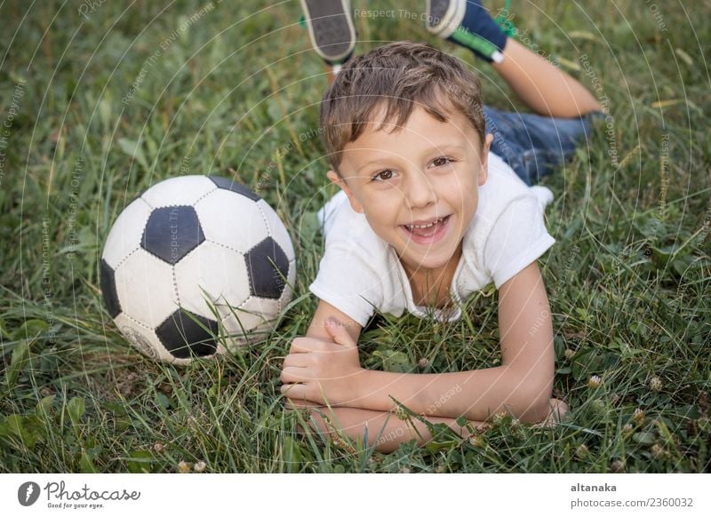 Portrait of a young boy with soccer ball. Concept of sport. Lifestyle Joy Happy Relaxation Leisure and hobbies Playing Summer Sports Soccer Child Human being