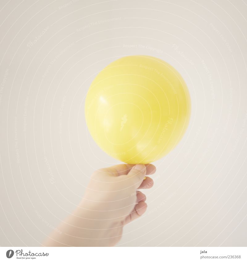 balloon Hand Fingers Balloon Friendliness Bright Yellow Joy Colour photo Interior shot Copy Space left Copy Space right Copy Space top Neutral Background Day